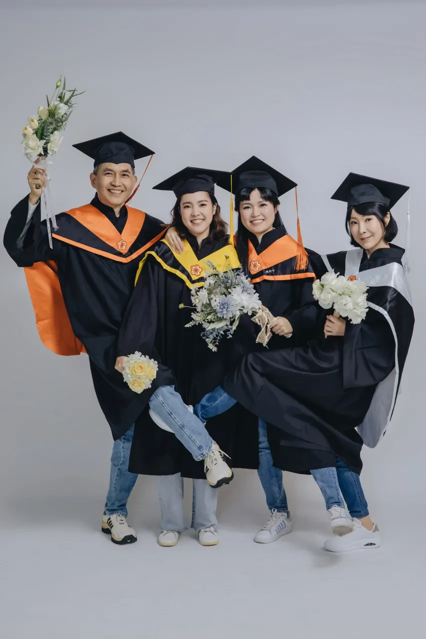 Graduation family photoshoot Singapore - graduate in regalia with family