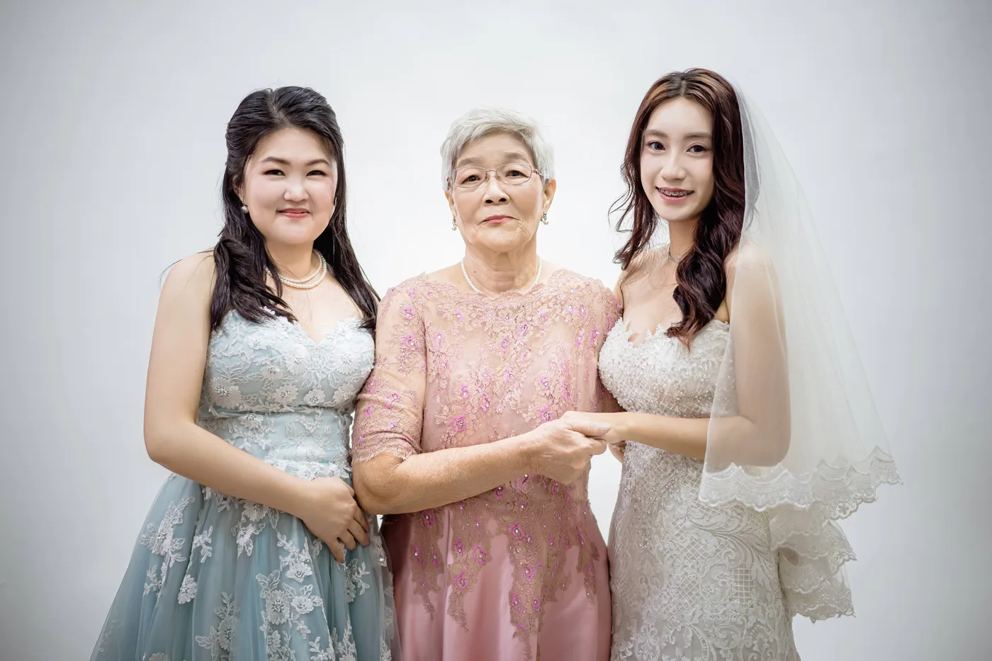 Family photoshoot wardrobe Singapore - gowns and suits from the Cang-Ai studio