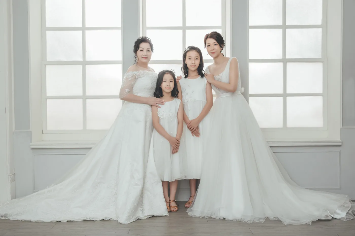 Family photoshoot wardrobe Singapore - gowns and suits from the Cang-Ai studio