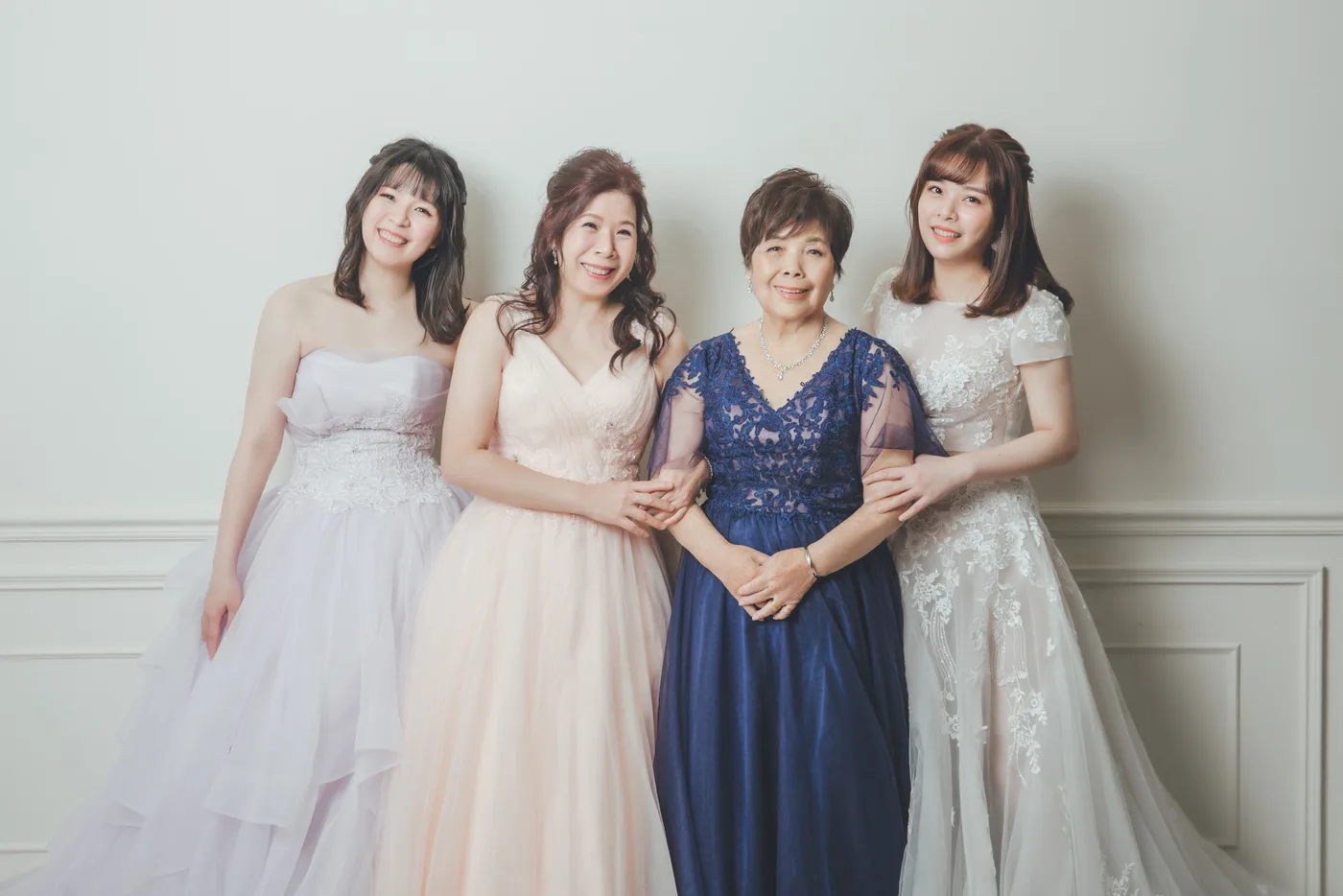 Family photoshoot wardrobe Singapore - gowns and suits from the Cang-Ai studio