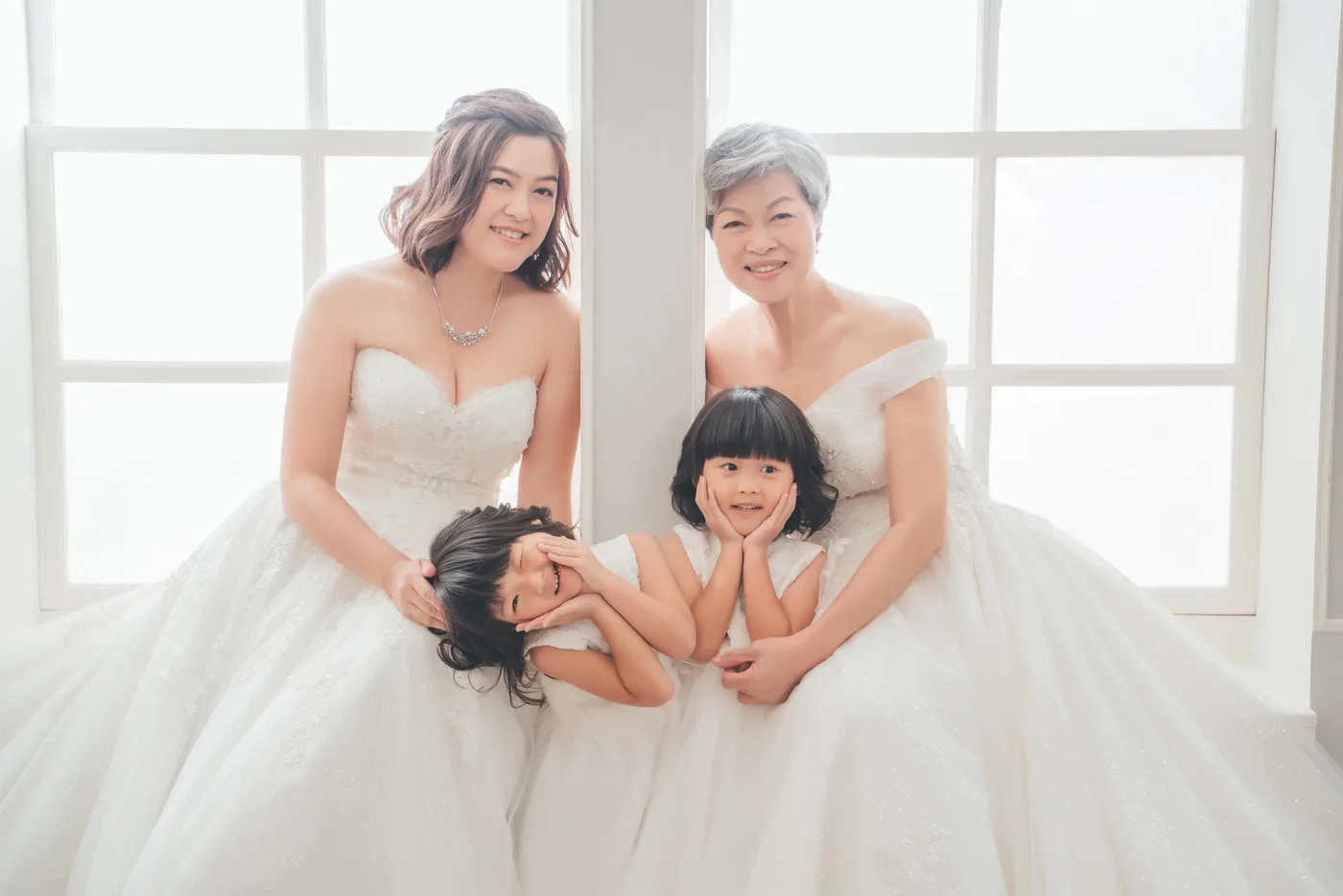 Family photoshoot wardrobe Singapore - gowns and suits from the Cang-Ai studio